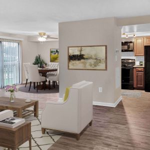 Apartment living room, dining room with furniture and kitchen with appliances