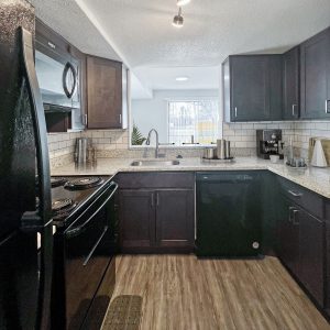 Kitchen with appliances in apartment